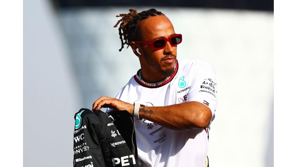 ABU DHABI, UNITED ARAB EMIRATES - NOVEMBER 26: Lewis Hamilton of Great Britain and Mercedes looks on from the drivers parade prior to the F1 Grand Prix of Abu Dhabi at Yas Marina Circuit on November 26, 2023 in Abu Dhabi, United Arab Emirates. (Photo by Mark Thompson/Getty Images)