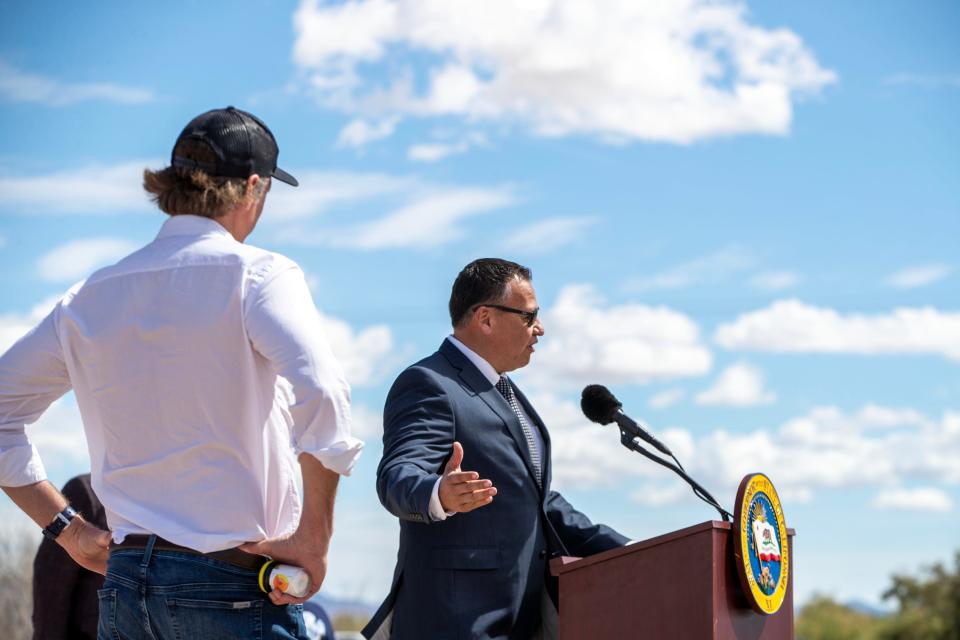Luis Olmedo, executive director of Comite Civic del Valle, speaks as Gov. Gavin Newsom holds a sample of Hell’s Kitchen lithium hydroxide during a press event at Controlled Thermal Resources in Calipatria, Calif., on Monday, March 20, 2023. 