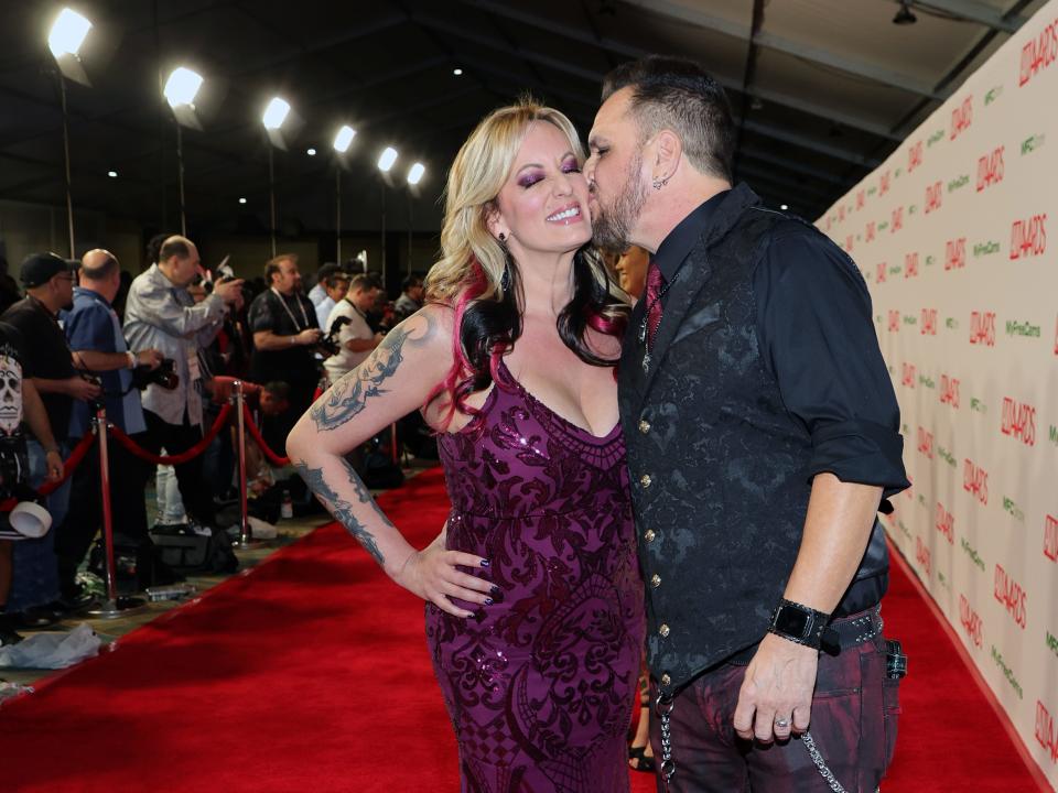 Adult film actress/director Stormy Daniels (L) is kissed by adult film actor/director Barrett Blade as they attend the 2023 Adult Video News Awards at Resorts World Las Vegas on January 07, 2023 in Las Vegas, Nevada.