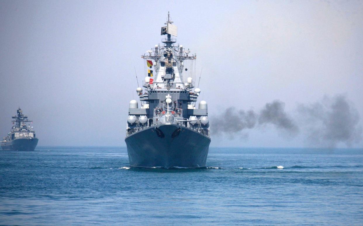 In this photo, a Russian naval vessel fires a shell during the China-Russia joint naval exercise in the Yellow Sea Thursday, April 26, 2012. - Xinhua