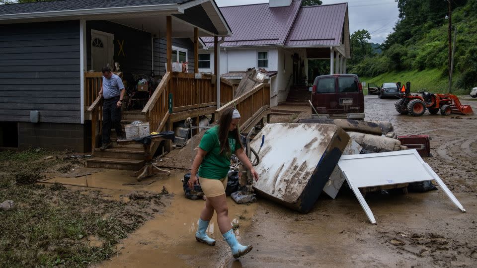 A local fire chief and his daughter drop off goods for a community member in Jackson, Kentucky, on July 31, 2022, after deadly flooding. - Seth Herald/AFP/Getty Images