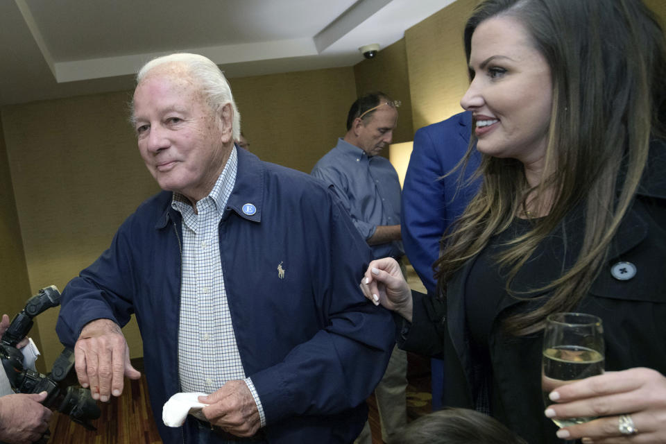 FILE - Former Gov. Edwin Edwards arrives with his wife Trina Edwards, right, to the election night watch party for current Louisiana Gov. John Bel Edwards in Baton Rouge, La., in this Saturday, Nov. 16, 2019, file photo. Edwin Washington Edwards, the high-living four-term governor whose three-decade dominance of Louisiana politics was all but overshadowed by scandal and an eight-year federal prison stretch, died Monday, July 12, 2021 . He was 93. Edwards died of respiratory problems with family and friends by his bedside, family spokesman Leo Honeycutt said. He had suffered bouts of ill health in recent years and entered hospice care this month at his home in Gonzales, near the Louisiana capital. (AP Photo/Matthew Hinton, File)