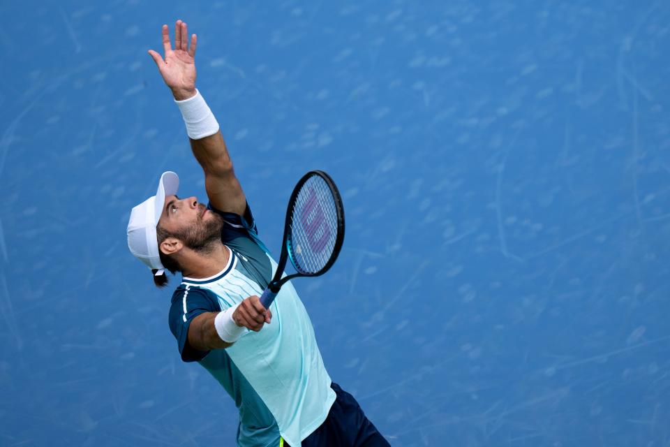 Borna Coric, of Croatia, serves to Sebastian Korda, of the United States, during the Western & Southern Open at the Lindner Family Tennis Center in Mason, Ohio, on Tuesday, Aug. 15, 2023.