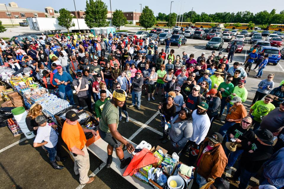 Hundreds gathered at Trotwood-Madison High School to branch out and help those hardest hit by tornadoes in the area. This group was just one of many groups helping. (WHIO File)