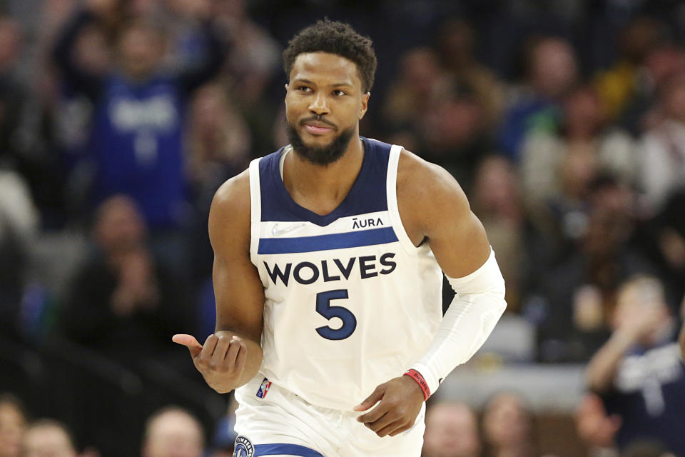 FILE- Minnesota Timberwolves guard Malik Beasley celebrates during the second half of an NBA basketball game against the Oklahoma City Thunder on March 9, 2022, in Minneapolis. Rudy Gobert has been traded by the Jazz to the Minnesota Timberwolves for a massive package of players and draft picks, a person with knowledge of the blockbuster deal said. Utah is getting four first-round picks between 2023 and 2029, along with Patrick Beverley, Malik Beasley and a first-round pick this year in Walker Kessler, according to the person who spoke to The Associated Press on Friday, July 1, 2022, on condition of anonymity because the NBA had not approved the deal and neither team could announce it publicly. (AP Photo/Andy Clayton-King, File)