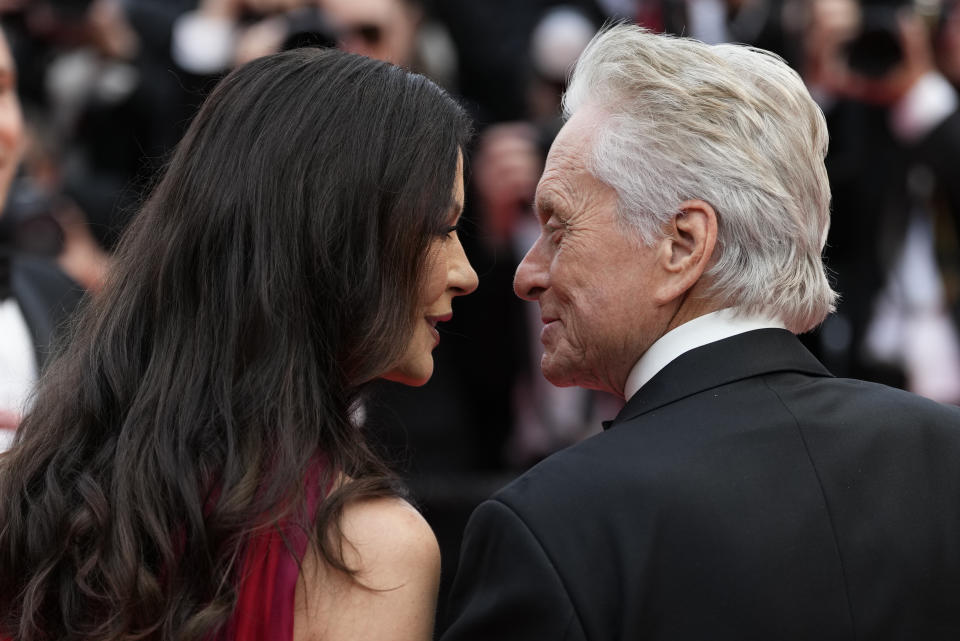 Catherine Zeta-Jones, left, and Michael Douglas pose for photographers upon arrival at the opening ceremony and the premiere of the film 'Jeanne du Barry' at the 76th international film festival, Cannes, southern France, Tuesday, May 16, 2023. (Photo by Scott Garfitt/Invision/AP)