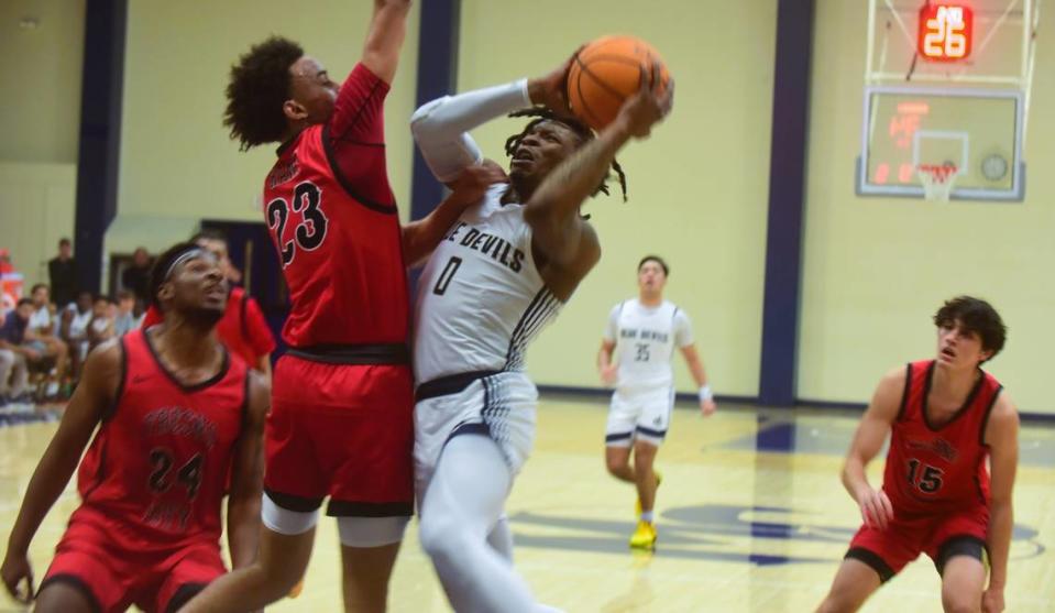 Merced College sophomore Tyreon Payne (0) goes up for a shot during a 124-108 loss to Fresno City on Wednesday, Jan. 10, 2024 at Don Reid Court.