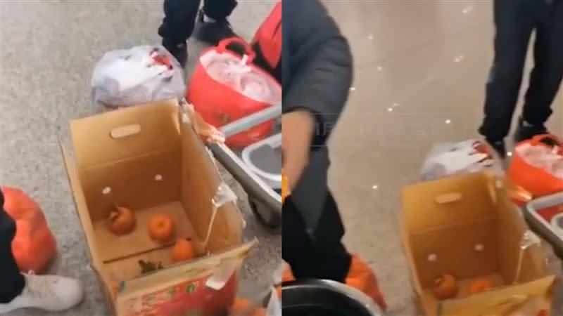 4名男子在機場吃完60斤橘子。（圖／翻攝自新周刊微博）
