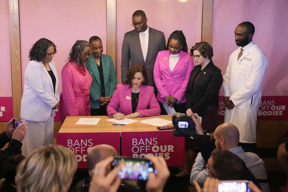 Michigan Gov. Gretchen Whitmer signs legislation to repeal the 1931 abortion ban statute, which criminalized abortion in nearly all cases during a bill signing ceremony, Wednesday, April 5, 2023, in Birmingham, Mich. The abortion ban, which fueled one of the largest ballot drives in state history, had been unenforceable after voters enshrined abortion rights in the state constitution last November. (AP Photo/Carlos Osorio)