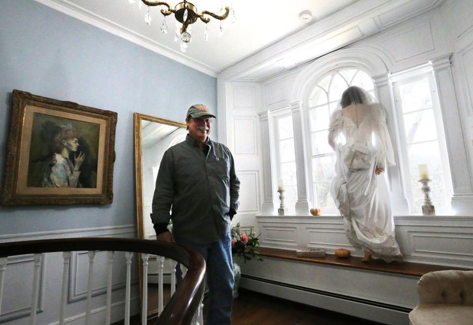 A mannequin bride stands in the second-floor window of the Wedding Cake House. Legend has it that she peers out the window as she waits for her groom. Homeowner Hunt Edwards has many intriguing and entertaining stories surrounding the well known tourist attraction of the Wedding Cake House.