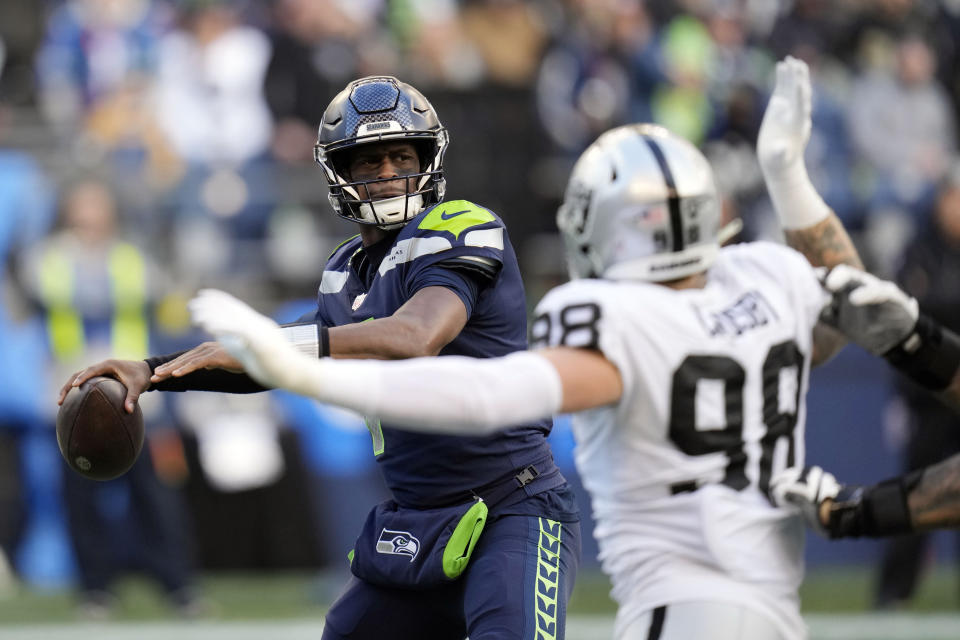Seattle Seahawks quarterback Geno Smith throws against the Las Vegas Raiders during the second half of an NFL football game Sunday, Nov. 27, 2022, in Seattle. (AP Photo/Gregory Bull)