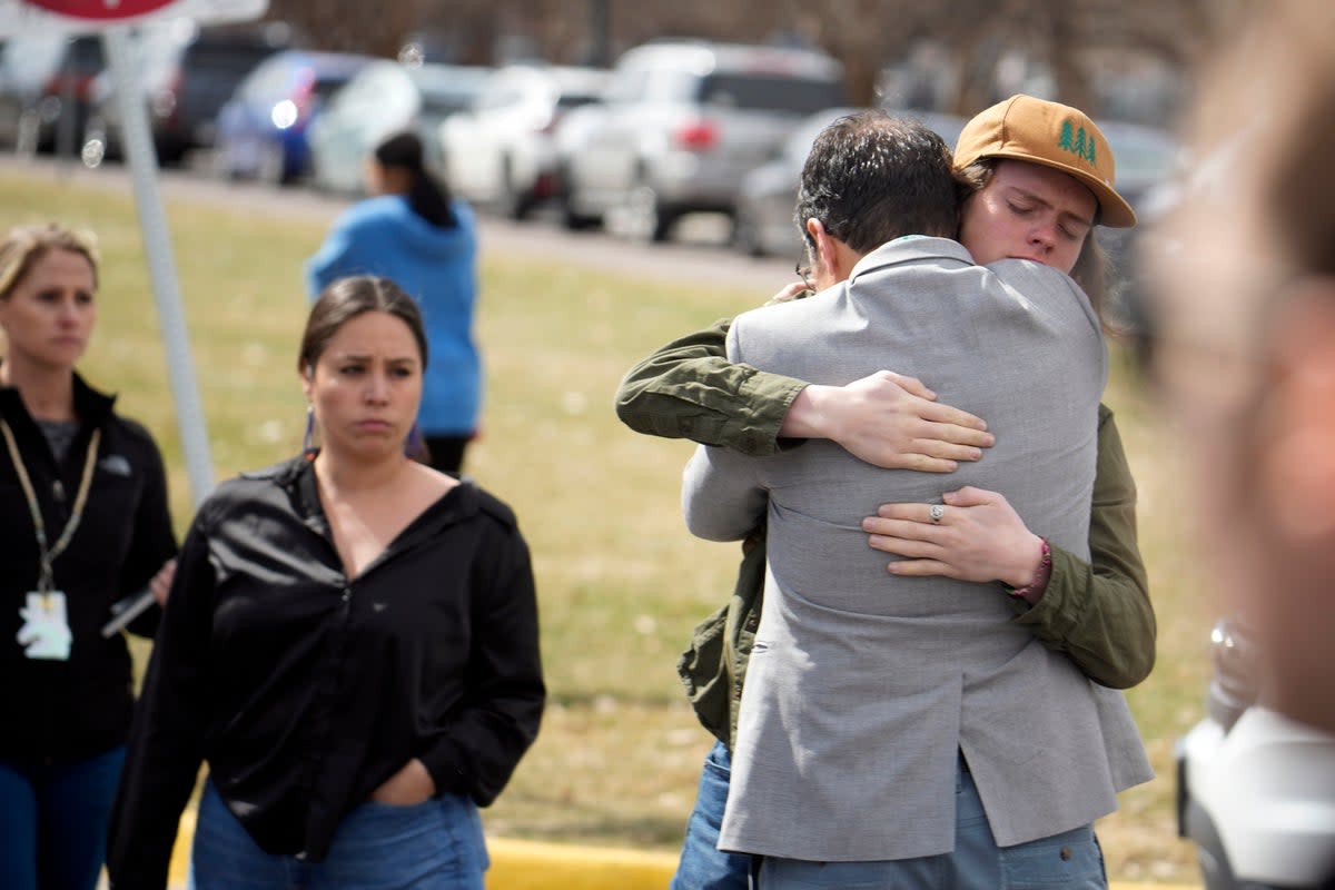 A student hugs a parent as they are reunited following a shooting at East High School (Copyright 2023 The Associated Press. All rights reserved.)