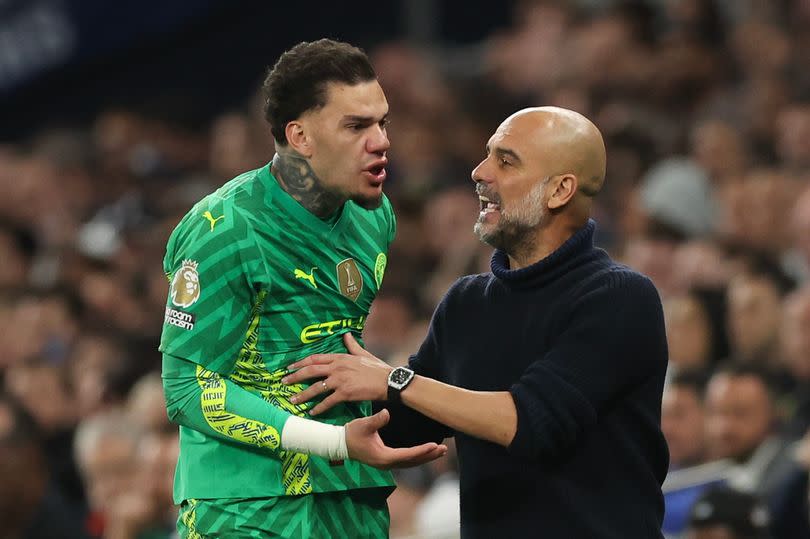 Pep Guardiola attempts to calm down Manchester City goalkeeper Ederson