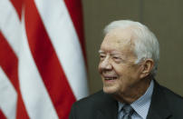 FILE - Former President Jimmy Carter smiles as he is awarded the Order of Manuel Amador Guerrero by Panamanian President Juan Carlos Varela during a ceremony at the Carter Center, Jan. 14, 2016, in Atlanta. Well-wishes and fond remembrances for the former president continued to roll in Sunday, Feb. 19, 2023, a day after he entered hospice care at his home in Georgia. (AP Photo/John Bazemore, File)