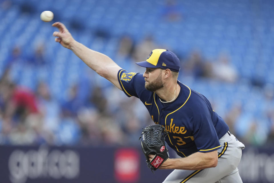 Milwaukee Brewers starting pitcher Adrian Houser throws to a Toronto Blue Jays batter during the first inning of a baseball game Tuesday, May 30, 2023, in Toronto. (Nathan Denette/The Canadian Press via AP)