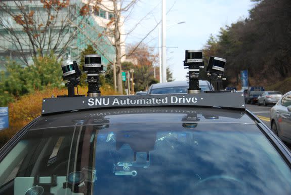 3D Lidar sensors on the car tracking obstacles around it.