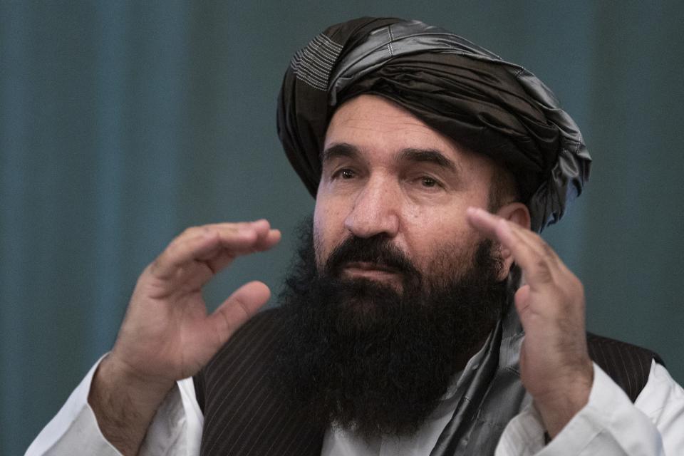 Khairullah Khairkhwa, former western Herat Governor and one of five Taliban released from the U.S. prison on Guantanamo Bay in exchange for U.S. soldier Bowe Bergdahl, gestures during a joint news conference in Moscow, Russia, Friday, March 19, 2021. The Taliban warned Washington against defying a May 1 deadline for the withdrawal of American and NATO troops from Afghanistan, and promising a "reaction," if the deadline is not met. (AP Photo/Alexander Zemlianichenko, Pool)