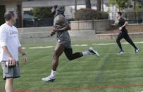 Los Angeles Lakers forward LeBron James sprints during NBA basketball training outdoors in El Segundo, Calif., Thursday, Jan. 30, 2020. The Lakers held their second practice Thursday, while they continue to grieve for former player Kobe Bryant. (AP Photo/Damian Dovarganes)