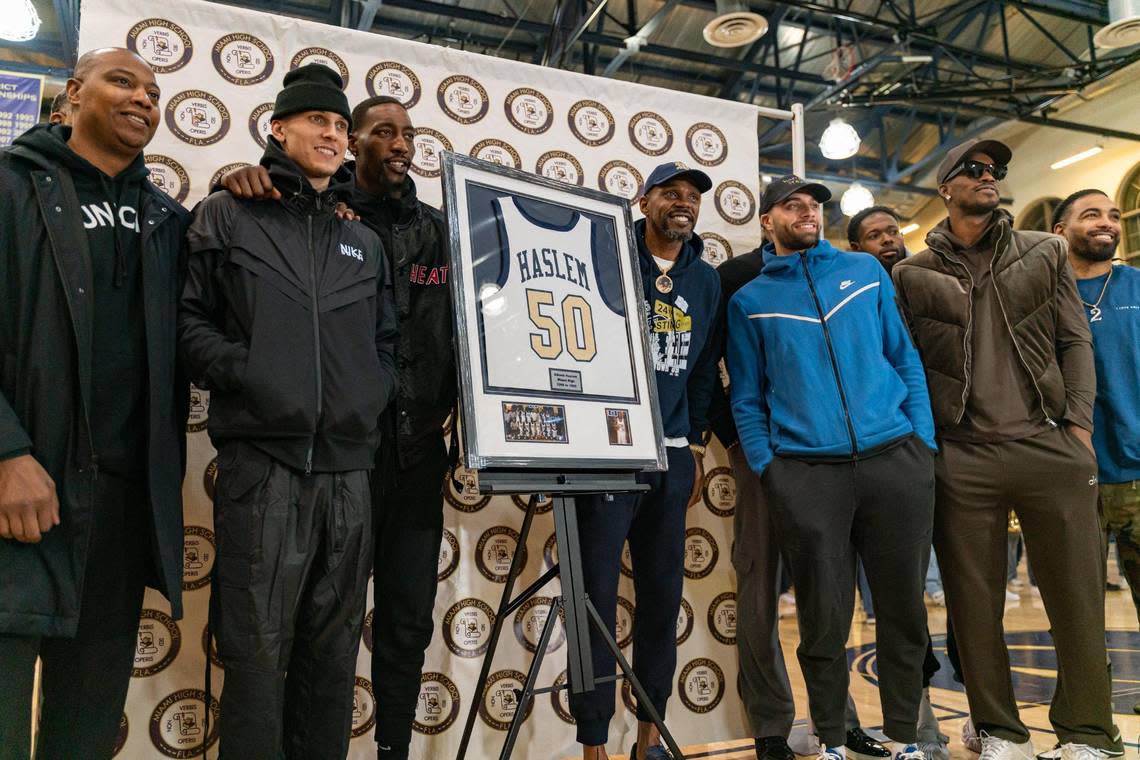 NBA Miami Heat teammates pose for a photo with forward Udonis Haslem (40) during his High School Jersey Retirement Ceremony at Miami Senior High School in Miami, Florida on Tuesday, December 27, 2022.