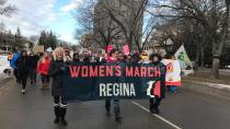 'The future is female': Regina girls march in solidarity with women around the world