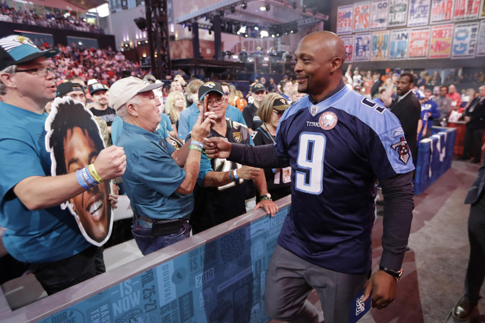 Former Tennessee Titans player Eddie George meets fans after announcing the pick for the Titans as Mississippi wide reciever A.J. Brown during the second round of the NFL football draft, Friday, April 26, 2019, in Nashville, Tenn. (AP Photo/Mark Humphrey)