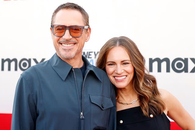 <p>MICHAEL TRAN/AFP via Getty </p> Robert Downey Jr. attends the premiere of 'Downey's Dream Cars' with Susan Downey