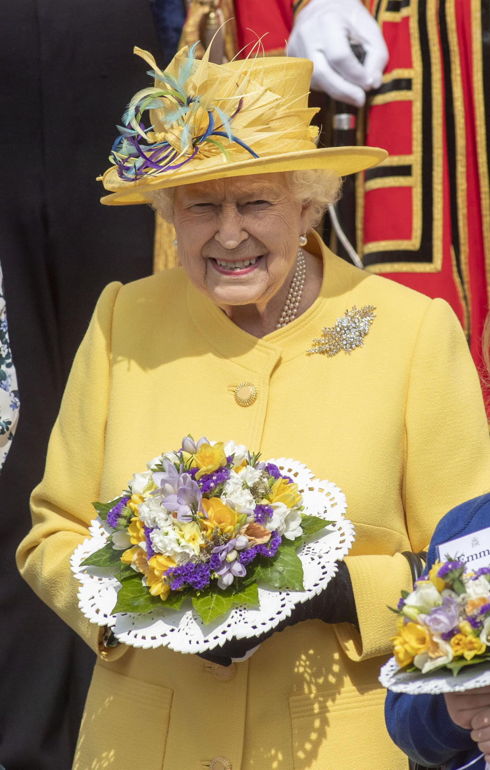 The Queen wore a buttercup yellow coat for the Maundy Thursday service [Photo: PA]