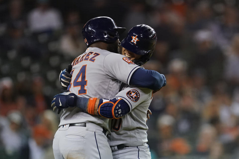 Houston Astros' Yuli Gurriel celebrates his two-run home run with Yordan Alvarez (44) in the seventh inning of a baseball game against the Detroit Tigers in Detroit, Tuesday, Sept. 13, 2022. (AP Photo/Paul Sancya)