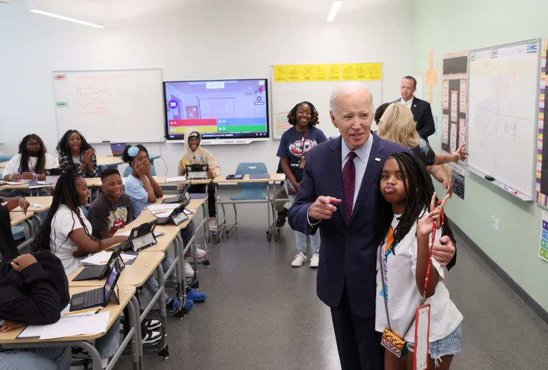 U.S. President Joe Biden and Jill Biden greet children on their first day of school in Washington