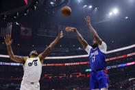 Los Angeles Clippers forward P.J. Tucker (17) scores a 3-pointer against Utah Jazz forward Brice Sensabaugh (8) during the first half of an NBA basketball game Friday, April 5, 2024, in Los Angeles. (AP Photo/Etienne Laurent)