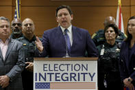 Florida Gov. Ron DeSantis speaks during a news conference at the Broward County Courthouse in Fort Lauderdale, Fla. on Thursday, Aug. 18, 2022. Florida Gov. Ron DeSantis on Thursday announced criminal charges against 20 people for illegally voting in 2020, the first major public move from the Republican's new election police unit. (Amy Beth Bennett/South Florida Sun-Sentinel via AP)