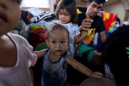 Evacuated residents gather at an evacuation centre in Iligan, while government forces fight insurgents from the Maute group in Marawi, Philippines June 27, 2017. REUTERS/Jorge Silva
