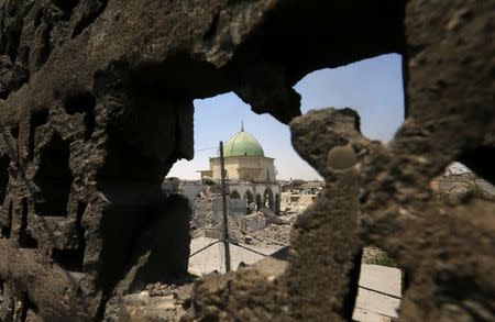 The ruined Grand al-Nuri Mosque is seen after it was retaken by the Iraqi forces from the Islamic State militants at the Old City in Mosul, Iraq, June 30, 2017. REUTERS/Alaa Al-Marjani