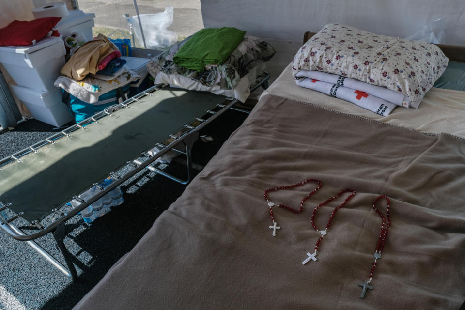 Image: Rosaries on a bed at Heriberto Cruz athletic track (Gabriella N. Baez / for NBC News)