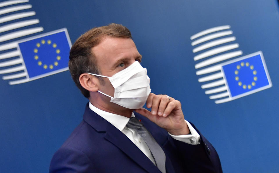 French President Emmanuel Macron arrives for an EU summit at the European Council building in Brussels, Friday, July 17, 2020. Leaders from 27 European Union nations meet face-to-face on Friday for the first time since February, despite the dangers of the coronavirus pandemic, to assess an overall budget and recovery package spread over seven years estimated at some 1.75 trillion to 1.85 trillion euros. (John Thys, Pool Photo via AP)