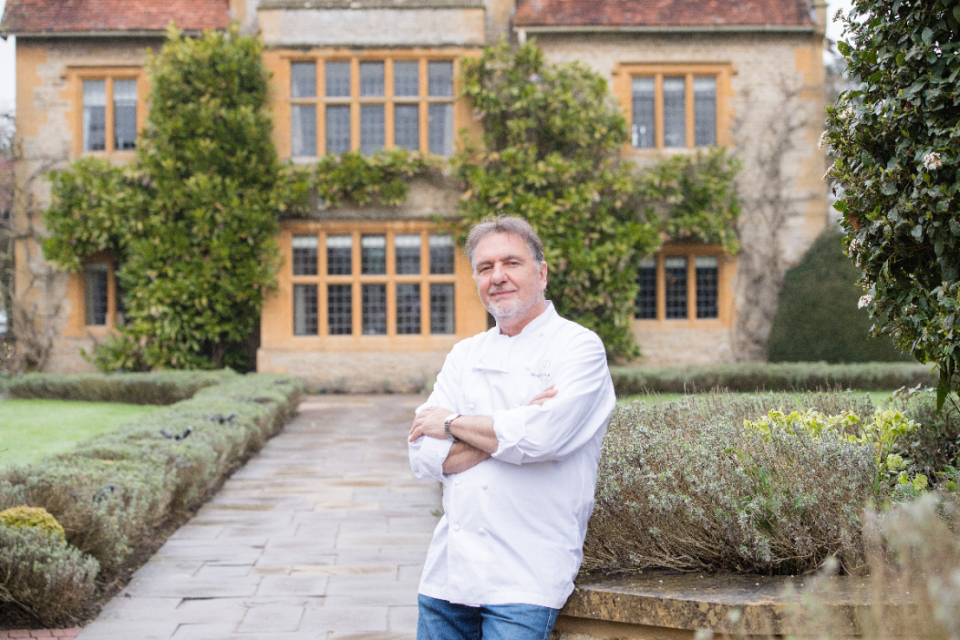 Raymond Blanc outside his restaurant with rooms, Le Manoir