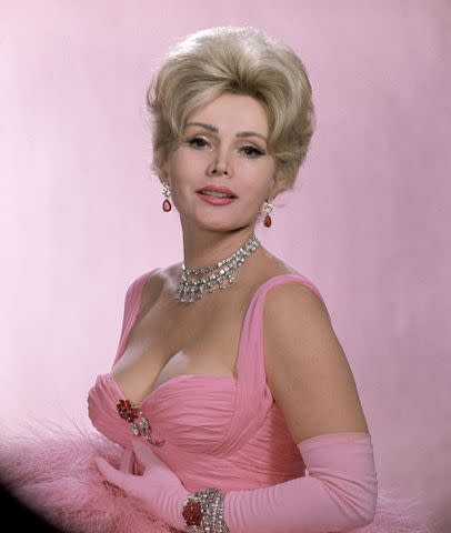 <p>The LIFE Picture Collection/Getty Images</p> Zsa Zsa Gabor wearing vulture feathers and $600,000 worth of jewelry for a Dune's Club appearance in Las Vegas in 1961.