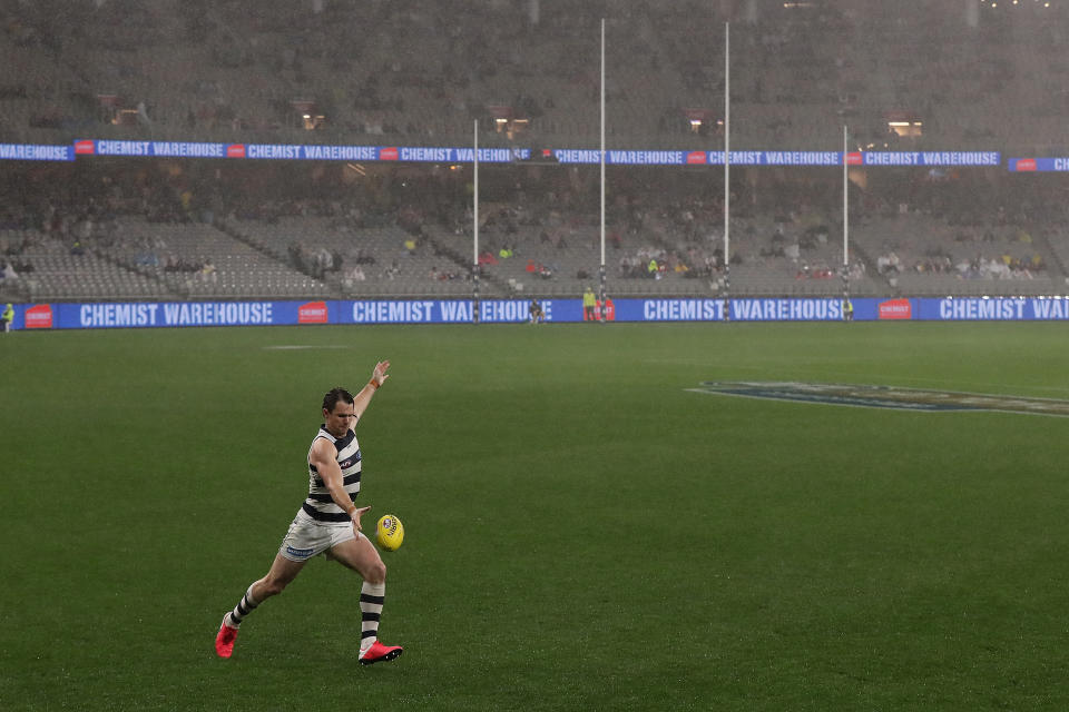 Patrick Dangerfield of the Cats kicks the ball into the forward line during the round 8 AFL match between the Fremantle Dockers and the Geelong Cats. 