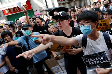 Anti-parallel trading protesters shout slogans during a march at Sheung Shui, a border town in Hong Kong