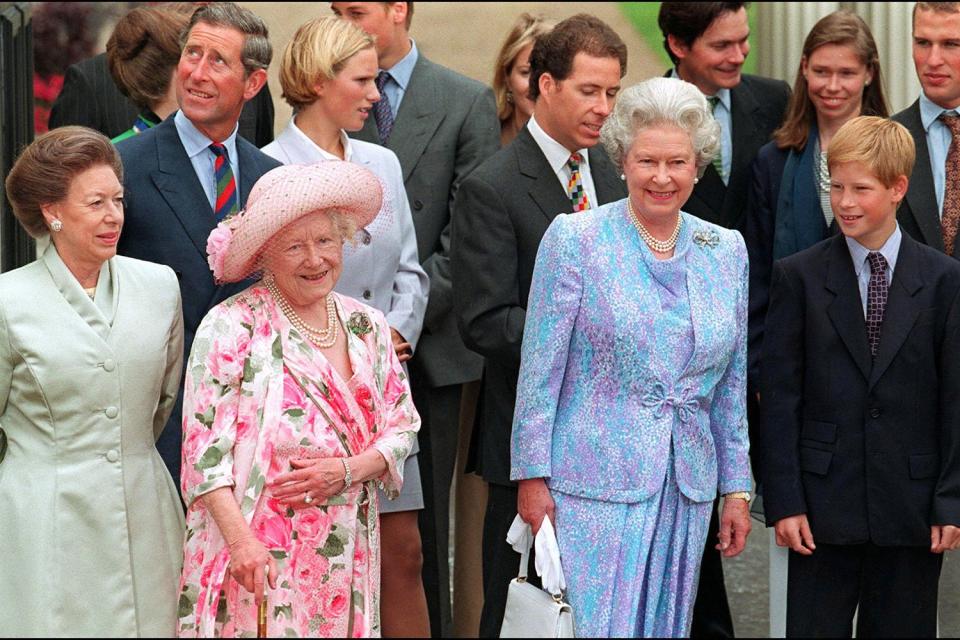 Harry stands close to his grandmother while celebrating the Queen Mother's 97th birthday in August 1997. 