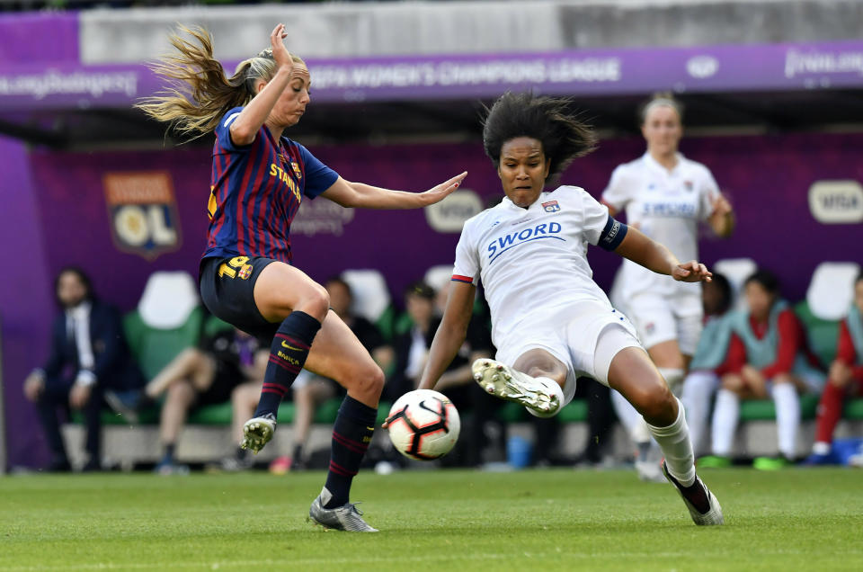 Wendie Renard of Lyon, right, in action against Toni Duggan of Barcelona, left, during the women's soccer UEFA Champions League final match between Olympique Lyon and FC Barcelona at the Groupama Arena in Budapest, Hungary, Saturday, May 18, 2019. (Tibor Illyes/MTI via AP)