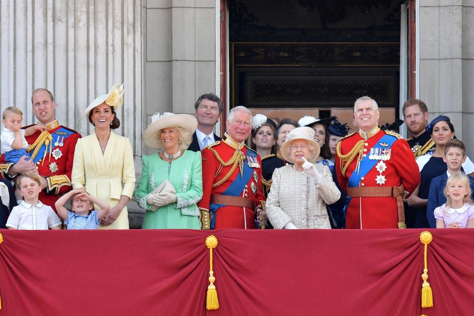 Prince William, Duke of Cambridge holding Prince Louis, Prince George, Princess Charlotte, Britain's Catherine, Duchess of Cambridge, Britain's Camilla, Duchess of Cornwall, Vice Admiral Timothy Laurence, Britain's Prince Charles, Prince of Wales, Britain's Princess Beatrice of York, Britain's Princess Anne, Princess Royal,, Britain's Queen Elizabeth II, Britain's Princess Eugenie of York, Britain's Lady Louise Windsor, Britain's Prince Andrew, Duke of York,, Britain's Prince Harry, Duke of Sussex,, Britain's Meghan, Duchess of Sussex, James, Viscount Severn and Isla Phillips stand with other members of the Royal Family on the balcony of Buckingham Palace to watch a fly-past of aircraft by the Royal Air Force