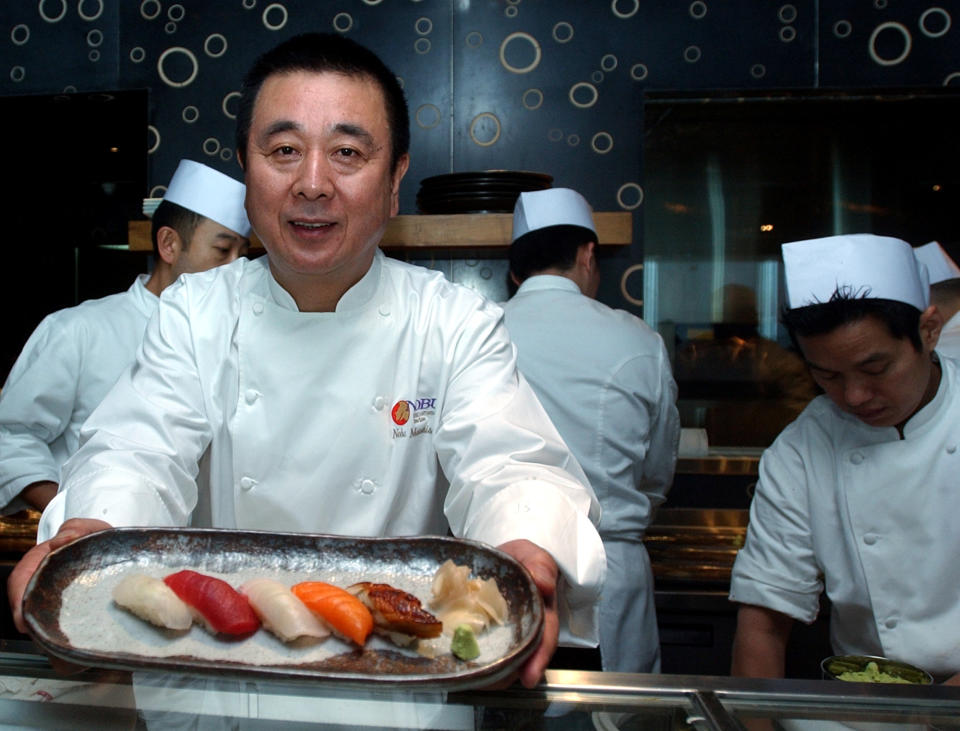 In this Jan. 10, 2007 file photo, celebrity Japanese chef Nobuyuki Matsuhisa shows off an assortment of sushi pieces he prepared for his new restaurant Nobu, at a press availability, in Hong Kong. Matsuhisa will be honored Saturday, Feb. 23, 2013, at the South Beach Wine and Food Festival for his fusion cuisine that blends Japanese and South American ingredients. (AP Photo/Lo Sai-hung)