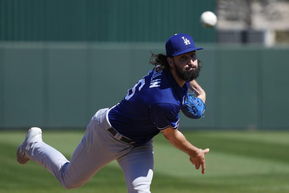 Dodgers starter Tony Gonsolin warms up before the first inning of a spring training game against the Angels.