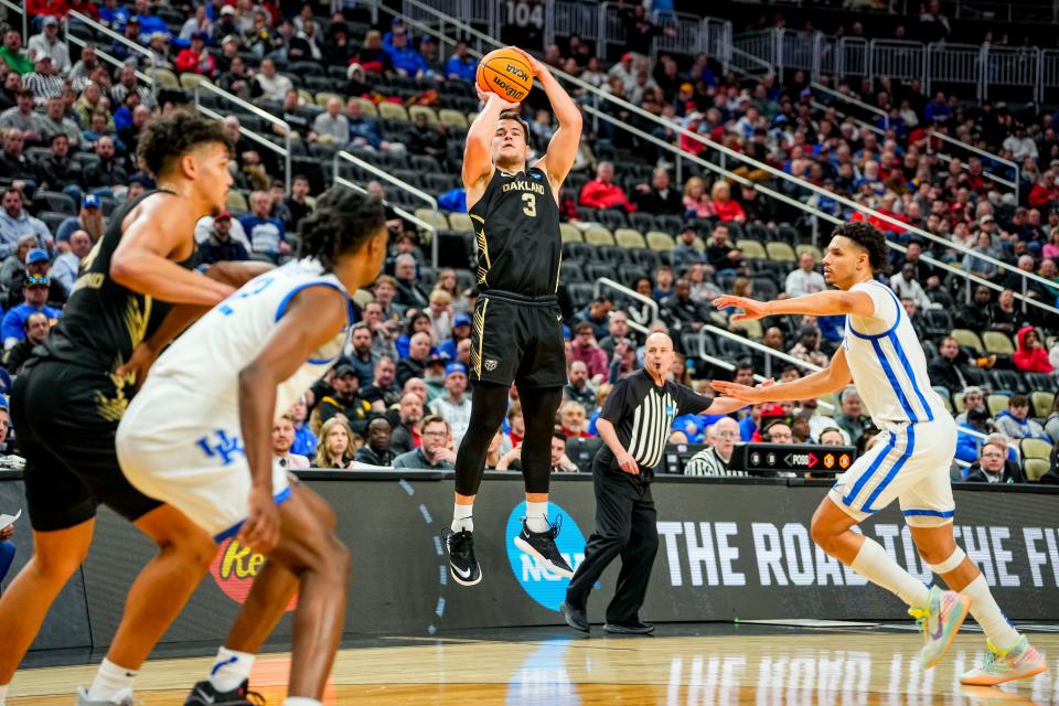Oakland Golden Grizzlies guard Jack Gohlke (3) jumps to shoot a three-pointer in the first round of the 2024 NCAA Tournament at PPG Paints Arena in Pittsburgh on Thursday.