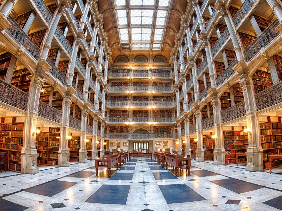 interior shot of the tall bookshelves at george peabody library in maryland