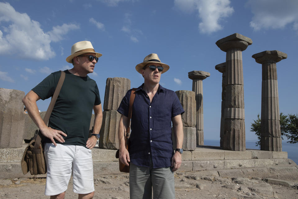 This image released by IFC Films shows Rob Brydon, right, and Steve Coogan in a scene from "The Trip to Greece," available Friday for rent on VOD and digital platforms. (Andy Hall/IFC Films via AP)