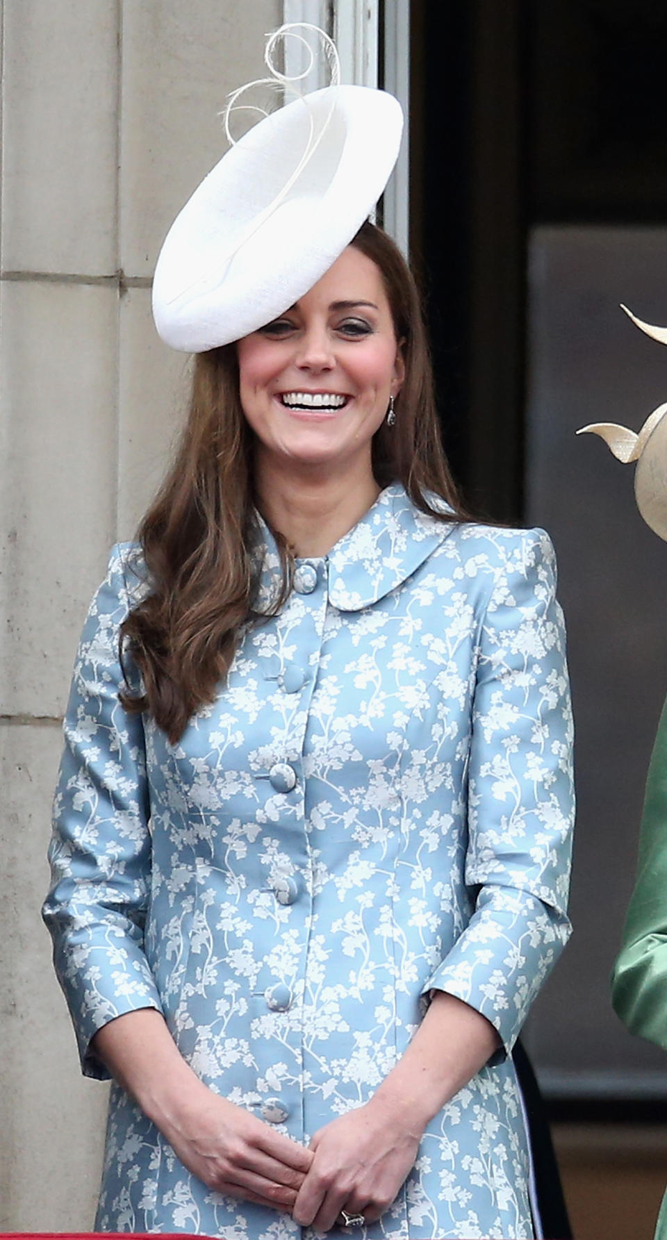 Shortly after Prince George’s birth, the Duchess of Cambridge donned a custom-made co-ord by Alexander McQueen. She accessorised the look with a Lock & Co fascinator. (Getty Images)