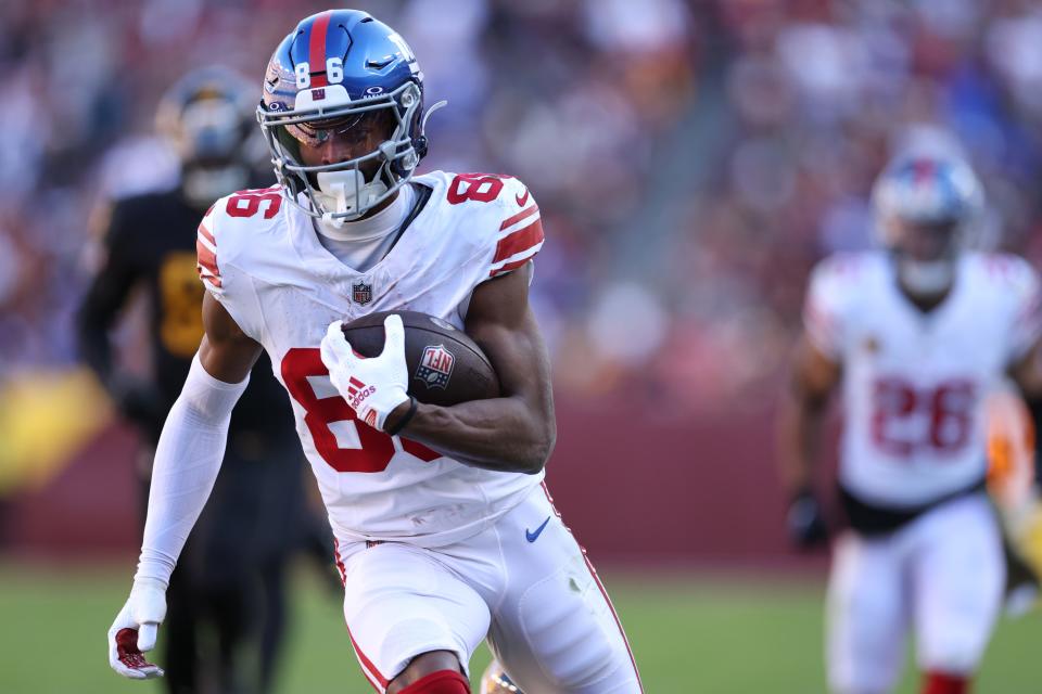 LANDOVER, MARYLAND - NOVEMBER 19: Darius Slayton #86 of the New York Giants catches a pass for a touchdown in the game against the Washington Commanders during the second quarter at FedExField on November 19, 2023 in Landover, Maryland. (Photo by Patrick Smith/Getty Images)