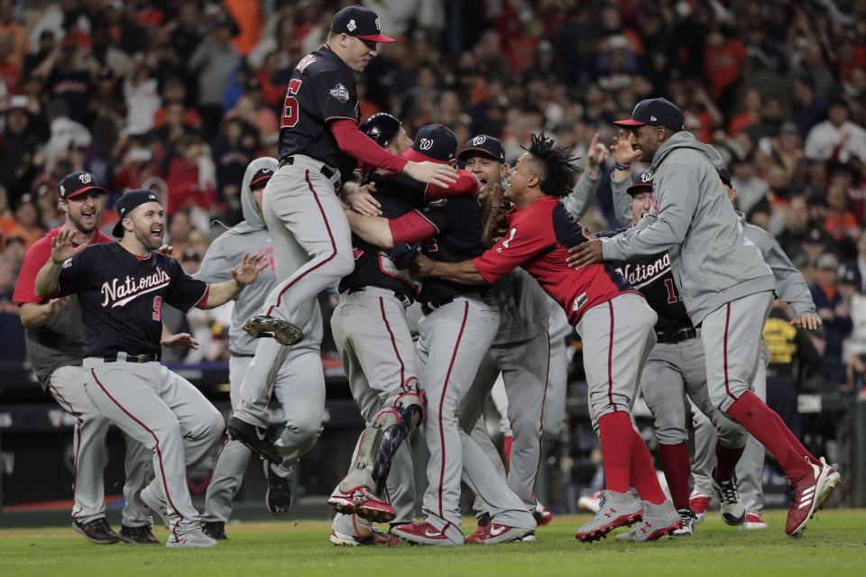 FILE - In this Wednesday, Oct. 30, 2019, file photo, The Washington Nationals celebrate after Game 7 of the baseball World Series against the Houston Astros in Houston. The Nationals won 6-2 to win the series. A year after winning the World Series thanks to a historic turnaround, the Nationals woke up Thursday, Sept. 24, 2020, with a 23-33 record and no mathematical chance of returning to the playoffs. (AP Photo/David J. Phillip, File)